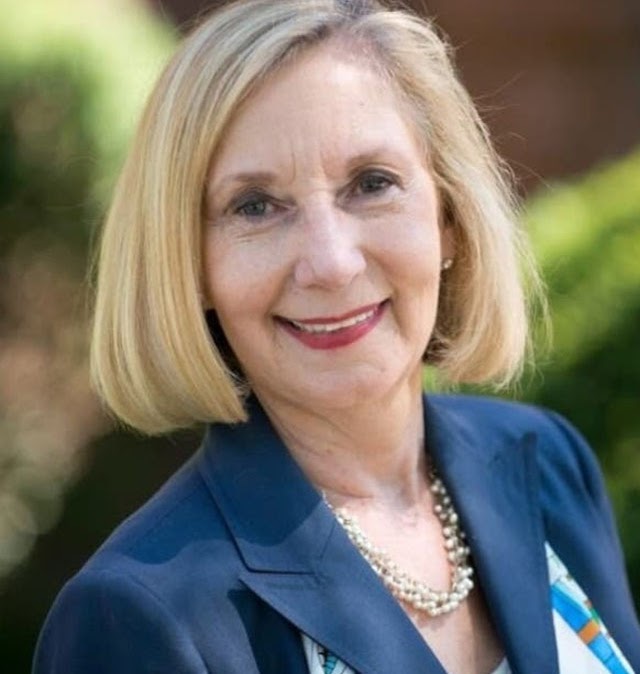 Robyn Gabel in a navy blazer and pearls.